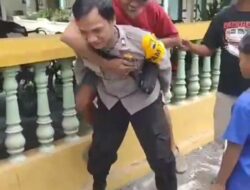 Aksi Heroik Personil Polres Sukoharo Mengendong Warga Menuju TPS